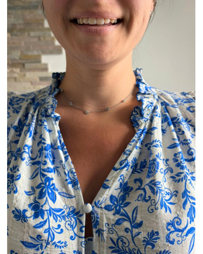 IVY | Blouse blanche fluide sans manche imprimé bleu