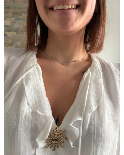 SAFIA | Blouse blanche broche soleil doré